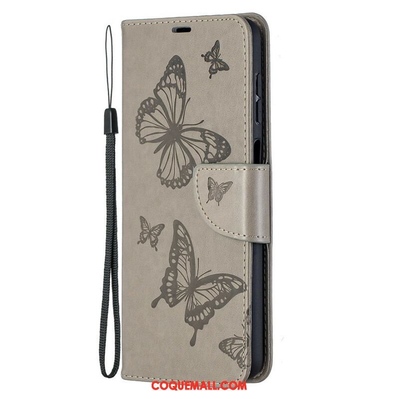 Housse Samsung Galaxy A12 / M12 Les Papillons en Vol avec Lanière
